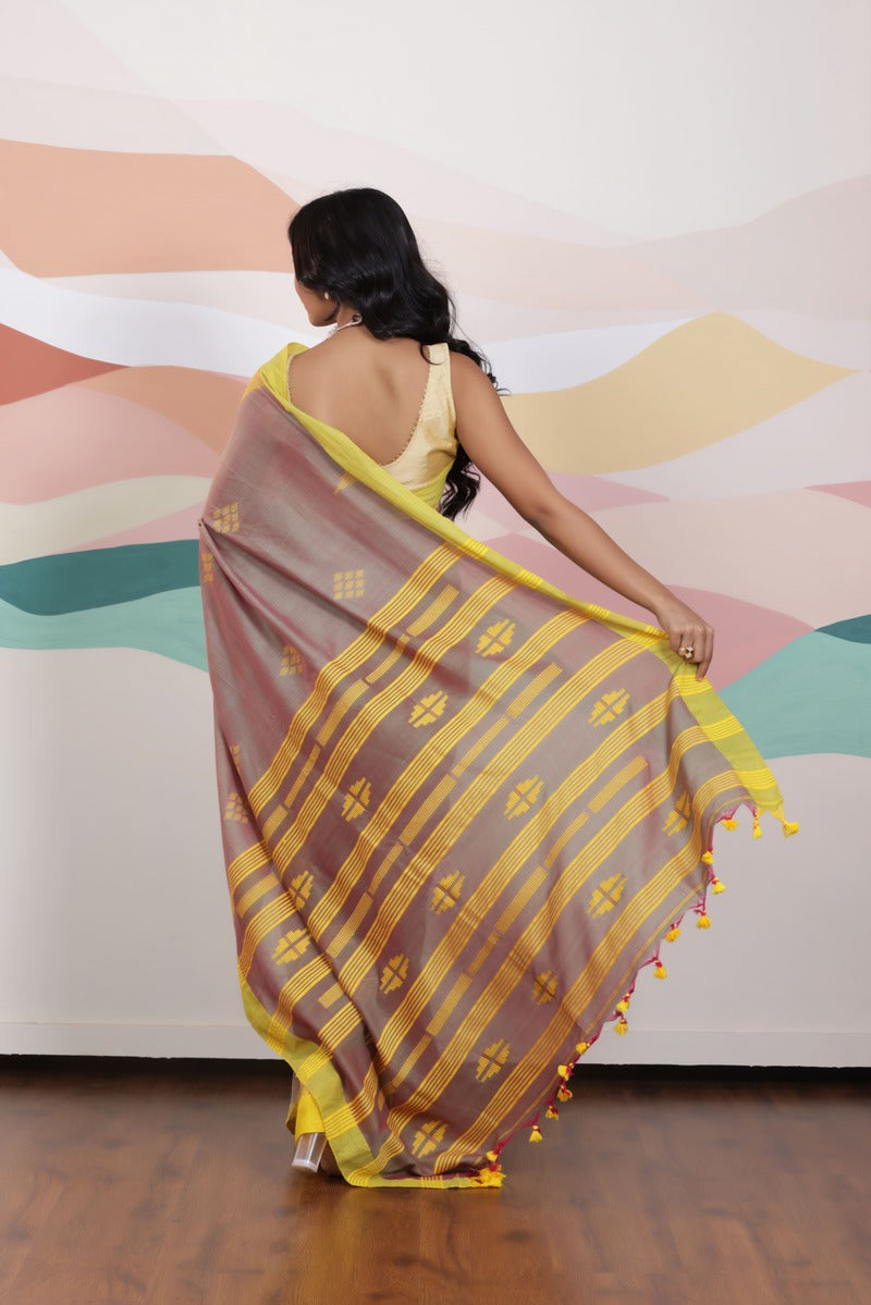 ARTISAN THREAD KHADI SAREE IN RICH BROWN WITH YELLOW WEAVES AND CONTRAST GREEN EDGE