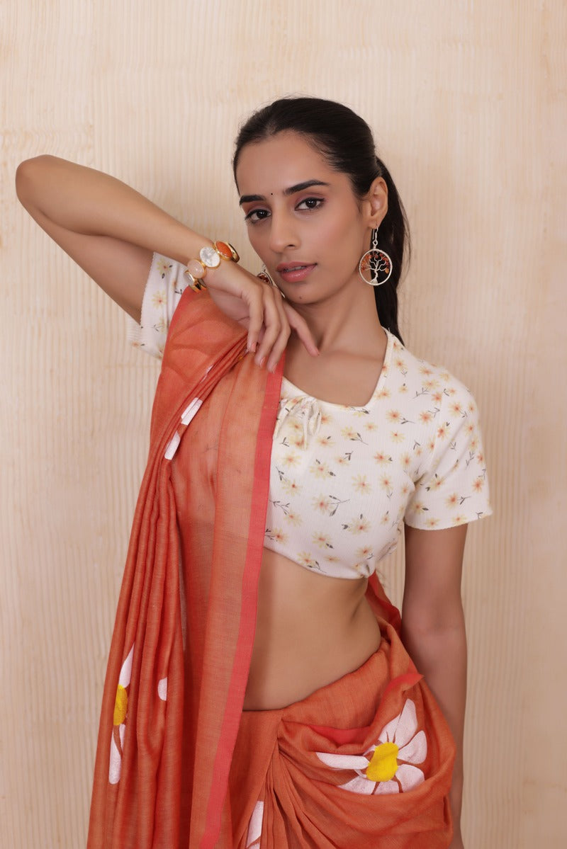 DAISY BLOOM  ORANGE HANDLOOM KHADI SAREE WITH WHITE FLORAL ARTWORK