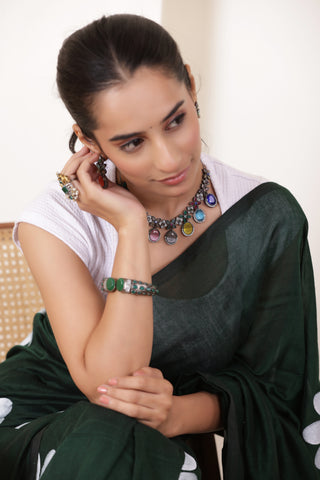 DAISY BLOOM  ARTISTIC KHADI SAREE IN BOTTLE GREEN WITH WHITE DAISY ARTWORK