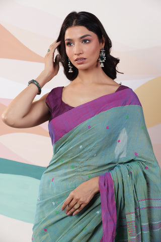 ARTISAN WOVEN LIGHT GREEN THREAD KHADI SAREE WITH COLOURFUL THREADED BUTTAS AND CONTRAST BORDER