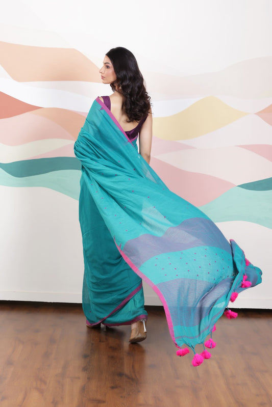 ARTISAN WOVEN THREAD KHADI SAREE IN ELEGANT DEEP GREEN WITH DELICATE BUTTA WEAVES AND CONTRAST TASSELS