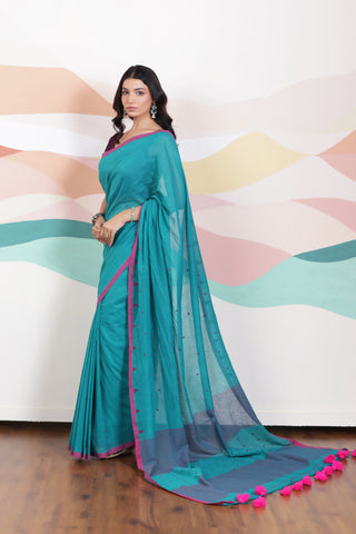 ARTISAN WOVEN THREAD KHADI SAREE IN ELEGANT DEEP GREEN WITH DELICATE BUTTA WEAVES AND CONTRAST TASSELS