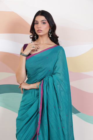 ARTISAN WOVEN THREAD KHADI SAREE IN ELEGANT DEEP GREEN WITH DELICATE BUTTA WEAVES AND CONTRAST TASSELS