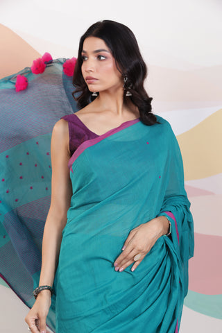 ARTISAN WOVEN THREAD KHADI SAREE IN ELEGANT DEEP GREEN WITH DELICATE BUTTA WEAVES AND CONTRAST TASSELS