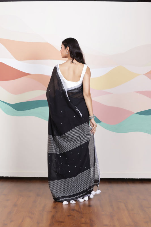 ARTISAN WOVEN THREAD KHADI SAREE IN ELEGANT BLACK WITH DELICATE BUTTA WEAVES AND CONTRAST TASSELS