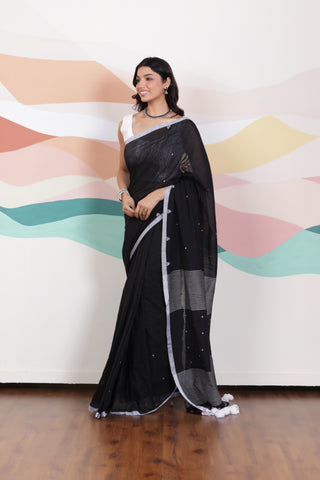 ARTISAN WOVEN THREAD KHADI SAREE IN ELEGANT BLACK WITH DELICATE BUTTA WEAVES AND CONTRAST TASSELS