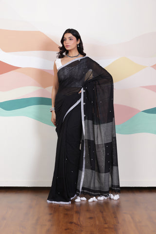 ARTISAN WOVEN THREAD KHADI SAREE IN ELEGANT BLACK WITH DELICATE BUTTA WEAVES AND CONTRAST TASSELS