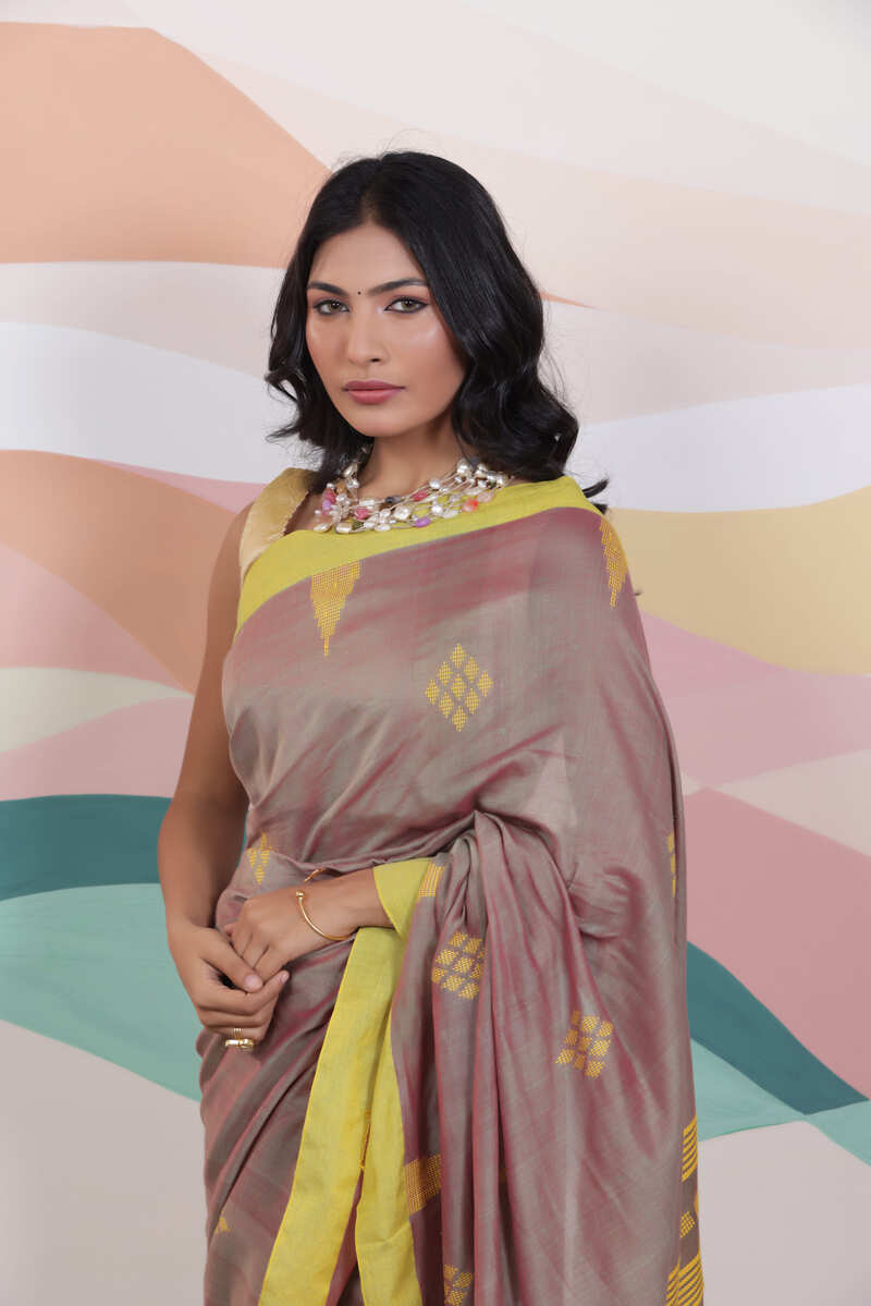 ARTISAN THREAD KHADI SAREE IN RICH BROWN WITH YELLOW WEAVES AND CONTRAST GREEN EDGE