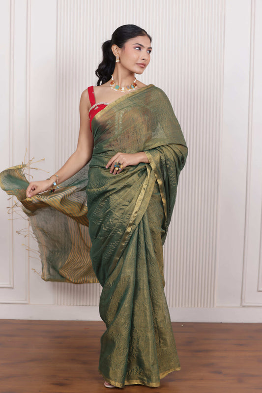 LUXE GREEN LINEN TISSUE SAREE WITH LUSTROUS ZARI STRIPES AND REFINED DRAPE