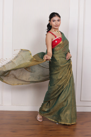 LUXE GREEN LINEN TISSUE SAREE WITH LUSTROUS ZARI STRIPES AND REFINED DRAPE