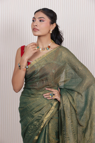 LUXE GREEN LINEN TISSUE SAREE WITH LUSTROUS ZARI STRIPES AND REFINED DRAPE