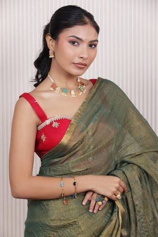 LUXE GREEN LINEN TISSUE SAREE WITH LUSTROUS ZARI STRIPES AND REFINED DRAPE