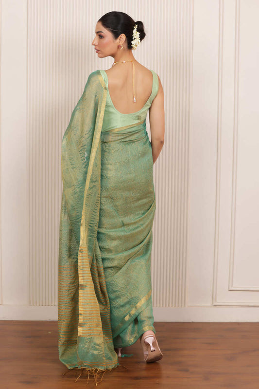 LUXE RAMAR GREEN LINEN TISSUE DRAPE WITH ELEGANT PALLU DETAILING AND LIGHT SHIMMER