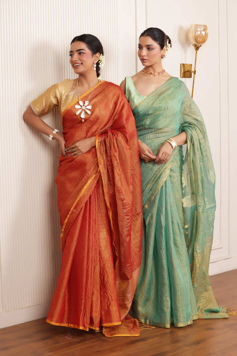 LUXE RAMAR GREEN LINEN TISSUE DRAPE WITH ELEGANT PALLU DETAILING AND LIGHT SHIMMER