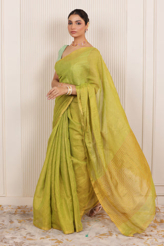 LUXE LIGHT GREEN LINEN SAREE WITH SOFT GOLD HIGHLIGHTS AND FESTIVE FINISH