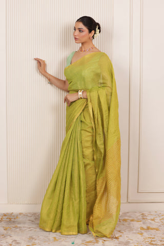 LUXE LIGHT GREEN LINEN SAREE WITH SOFT GOLD HIGHLIGHTS AND FESTIVE FINISH