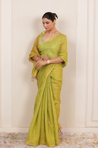 LUXE LIGHT GREEN LINEN SAREE WITH SOFT GOLD HIGHLIGHTS AND FESTIVE FINISH