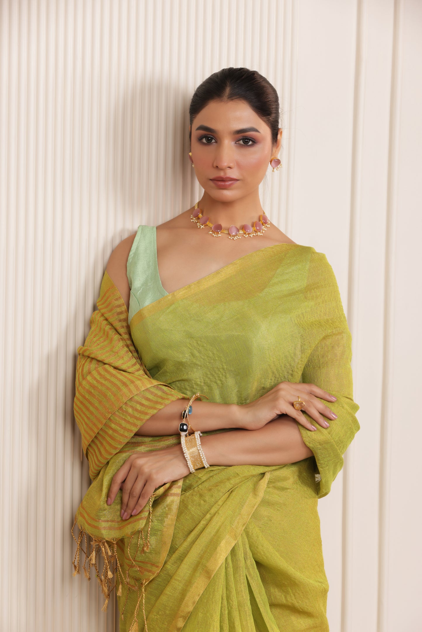 LUXE LIGHT GREEN LINEN SAREE WITH SOFT GOLD HIGHLIGHTS AND FESTIVE FINISH