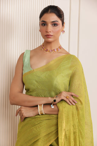 LUXE LIGHT GREEN LINEN SAREE WITH SOFT GOLD HIGHLIGHTS AND FESTIVE FINISH
