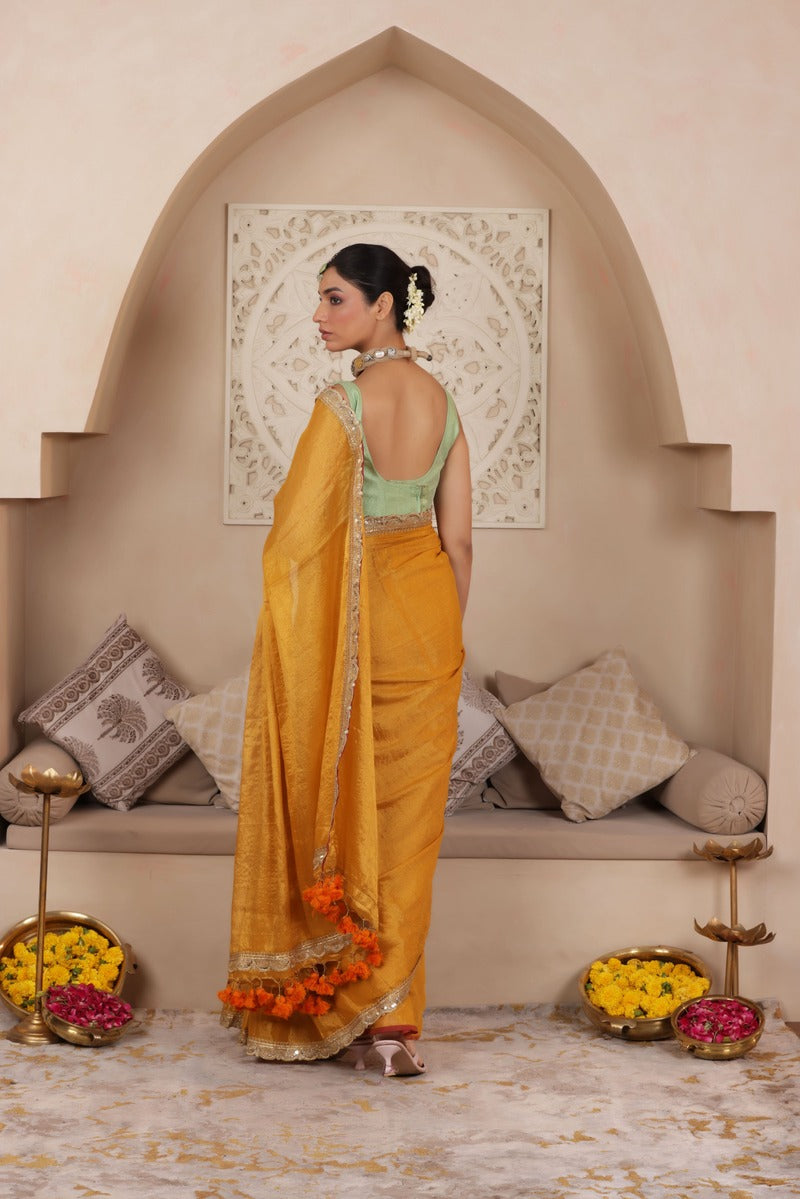 GOLDEN GRACE LUSTROUS TISSUE SAREE WITH ORNATE LACE EMBELLISHMENT