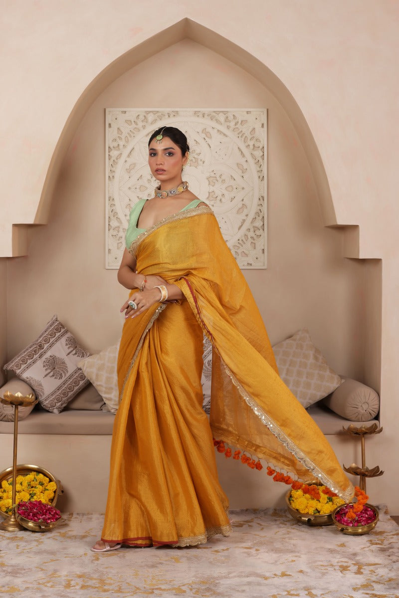 GOLDEN GRACE LUSTROUS TISSUE SAREE WITH ORNATE LACE EMBELLISHMENT