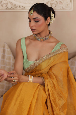 GOLDEN GRACE LUSTROUS TISSUE SAREE WITH ORNATE LACE EMBELLISHMENT