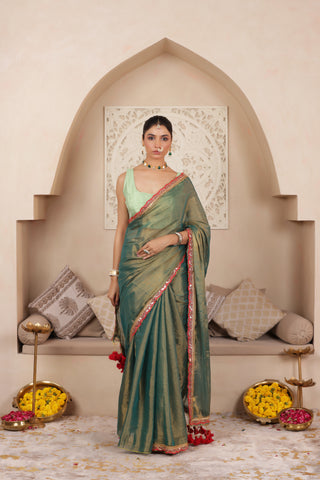 GREEN CHARM LUSTROUS TISSUE SAREE WITH REFINED LACE BORDER