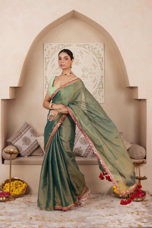 GREEN CHARM LUSTROUS TISSUE SAREE WITH REFINED LACE BORDER