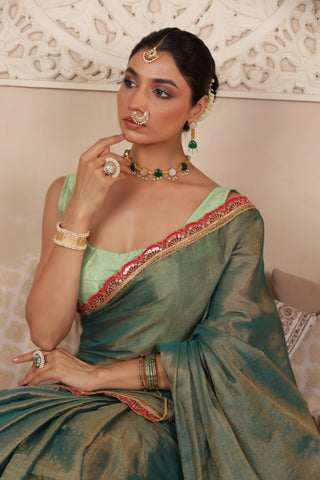 GREEN CHARM LUSTROUS TISSUE SAREE WITH REFINED LACE BORDER