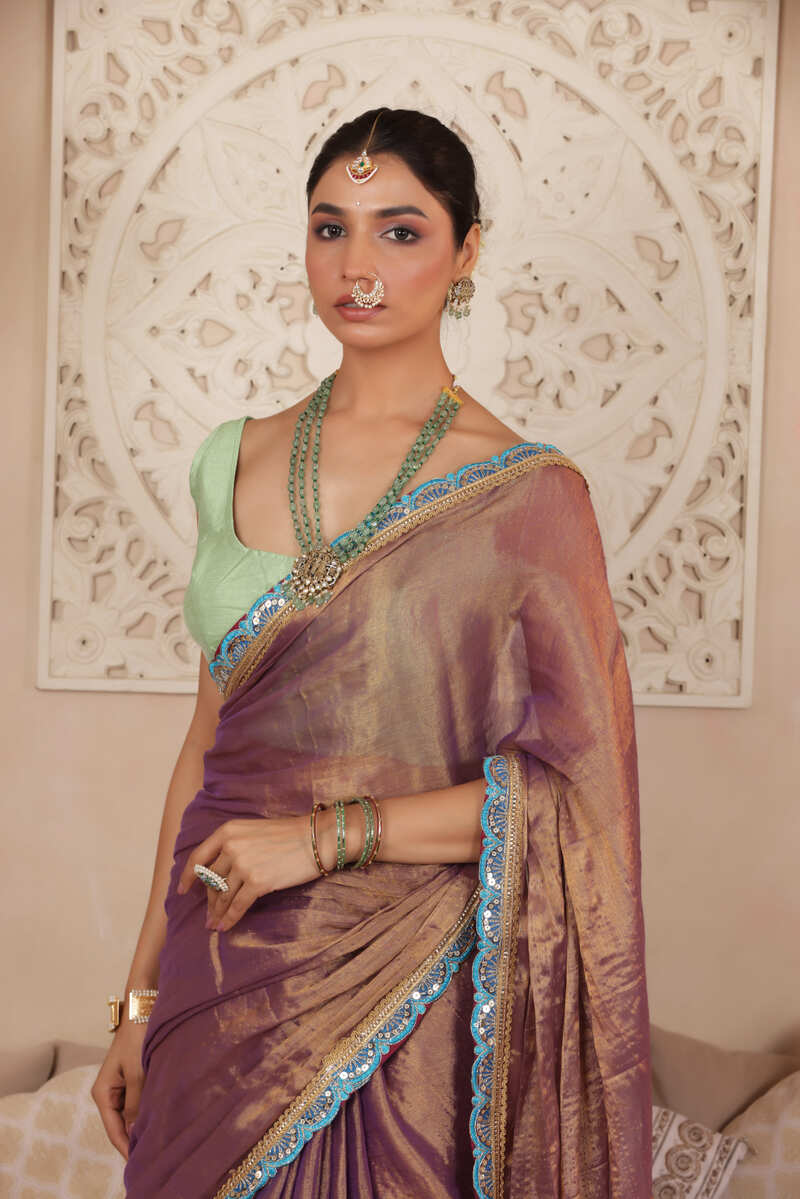 LUSTROUS TISSUE SAREE IN VIOLET WITH BLUE DETAILED WITH BEAUTIFUL LACE WORK